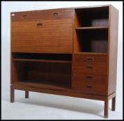A superb 1960's Danish influence teak wood sideboard cabinet raised on squared legs having a thin