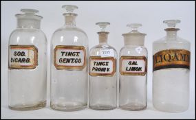 A collection of five vintage late 19th century W N Chemist Apothecary bottles .