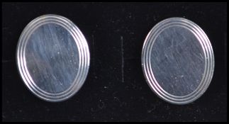 A pair of gentlemans silver cufflinks marked Tiffany.