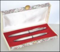 William H Manton - A silver hallmarked cased ball point pen and propelling pencil set by William H