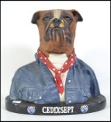 A retro 1990's advertising counter shop display bust of a boxer dog in denim.