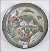 A stunning 20th century studio pottery stoneware wall charger.