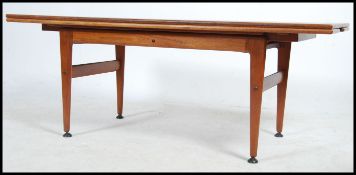 A rare and unusual 1970's metamorphic extending fold over Danish coffee table.