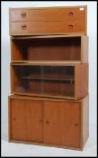 A retro mid century teak wood PS style modular wall system comprising of a bank of 2 drawers,