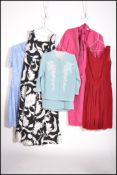 A collection of five vintage / retro ladies dresses of various designs and styles by various makers