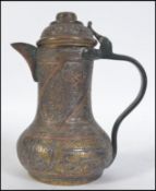 A middle eastern metalware brass and copper coffee pot, probably Turkish, tapering circular form,