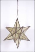 An unusual 20th century large coloured yellow glass and lead lined lantern in the form of a star (