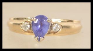 A14ct gold 3 stone amethyst and diamond ring. Marked 14K SECA. Size M. Weight 3.2g.