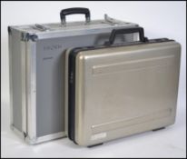 A retro cased Sony VHS recorder - CCD-V100E together with a retro silvered flight case with