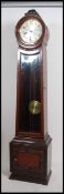 An Edwardian mahogany longcase clock with barrel / cylinder head having inset silvered dial with