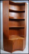 A G-Plan retro 1970's large teak wood curved corner cabinet having base and upright shelf together