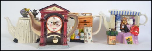 A collection of four large limited edition collectors novelty teapots by Paul Cardew.