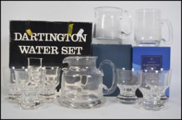A boxed retro Dartington crystal seven piece water set consisting of six glasses and water jug