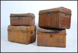 A collection of 19th century tin - metal trunk chests - ideal tack chests all with hinged lids.