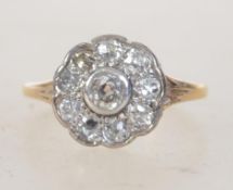 A 9ct gold and diamond cluster ring.