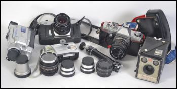 A collection of cameras and accessories to include a Praktika MTL3 in case with lens,