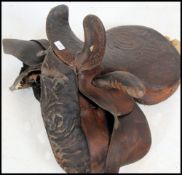 A believed 19th century Victorian ladies leather embossed and tooled side saddle with stitched
