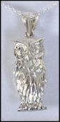 A ladies silver lucky owl pendant necklace and chain, the pendant mounted to a fine linked chain.