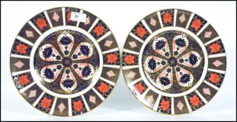 A pair of 20th century Royal Crown Derby cabinet plates in an Imari pattern. Pattern No 1128.