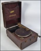 A vintage early 20th century portable wooden cased vinyl covered gramophone.