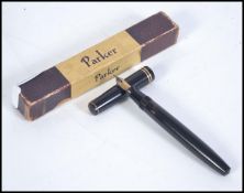 A vintage mid 20th Century cased Parker Victory fountain pen with a 14k gold nib in the original