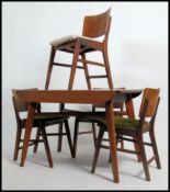 A 1950's vintage roll top / tambour leaf walnut dining table and chairs - suite.