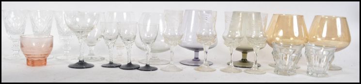 A collection of 20th century glasswares to include sherry glasses with acid etched examples, lustre,