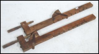 A stunning pair of vintage early 20th century Industrial large carpenters wooden adjustable clamps.