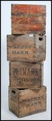 A stack of vintage mid century wooden advertising beer bottle crates,