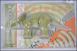 An original Swatch Dinosaur ' Skeleton ' wristwatch complete in the original packaging having the