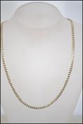 A hallmarked 9ct gold diamond cut flat curb link chain necklace. Hallmarked for Sheffield.