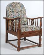 A 20th century open framed oak recliner armchair / fireside , early 20th Century,
