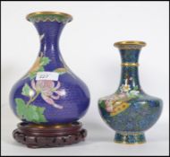 2 Chinese / Japanese enamel vases of baluster form, each with waisted necks,