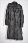 A vintage 1970's full length black leather gents overcoat. Retainiing it's original waist belt.