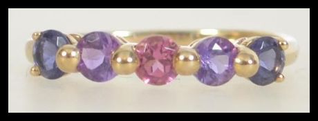 A 9ct gold and 5 stone coloured topaz ring. Weight 1.8g. T.5.