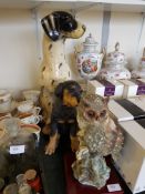 A large ceramic figurine of a dalmation dog together with a resin cast figurine of a dog by Fraser