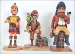 An impressive hand carved and crafted wooden collection of figurines to include Roman Legion