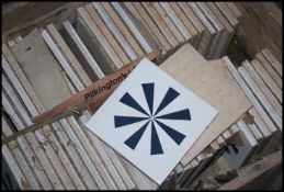 A large collection of decorative ceramic glazed tiles with geometric designs by Carter Pilkington