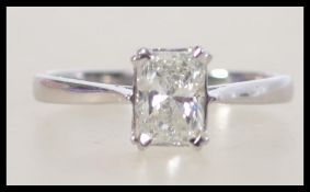 An 18ct white gold emerald cut diamond ladies ring. The diamond approx 1.