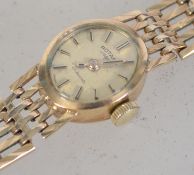 A 9ct gold / 375 marked ladies Rotary cocktail dress watch and bracelet.