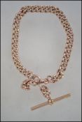 A hallmarked 9ct rose gold fob watch chain with T bar. Maker B & S. Hallmarked for Birmingham 1919.