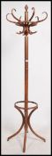 A 20th century bentwood coat stand in the manner of Thonet. Shaped legs to base with hooks atop.