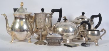 A collection of silver plate to include teapots, goblets, table lighters,