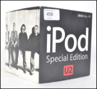 An Original first Generation Apple U2 Ipod which Includes packaging and poster etc