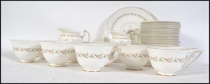 A Royal Doulton tea service in the ' Golden Spice ' pattern no H4917 comprising cups, saucers,