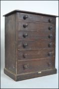 A late 19th century Victorian pine specimen chest with six graduated drawers raised on a plinth