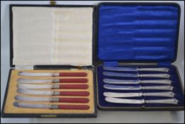 A cased set of silver hallmarked handles fruit knives with rubbed marks along with another cased