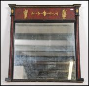 A large mid 20th century Adams revival wall overmantel mirror with ebonised frame having a diorama