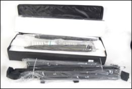 A complete photographic studio set up being new and unused to include tripods,