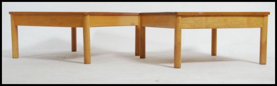 A pair of vintage / retro Ercol blond wood coffee / occasional tables.